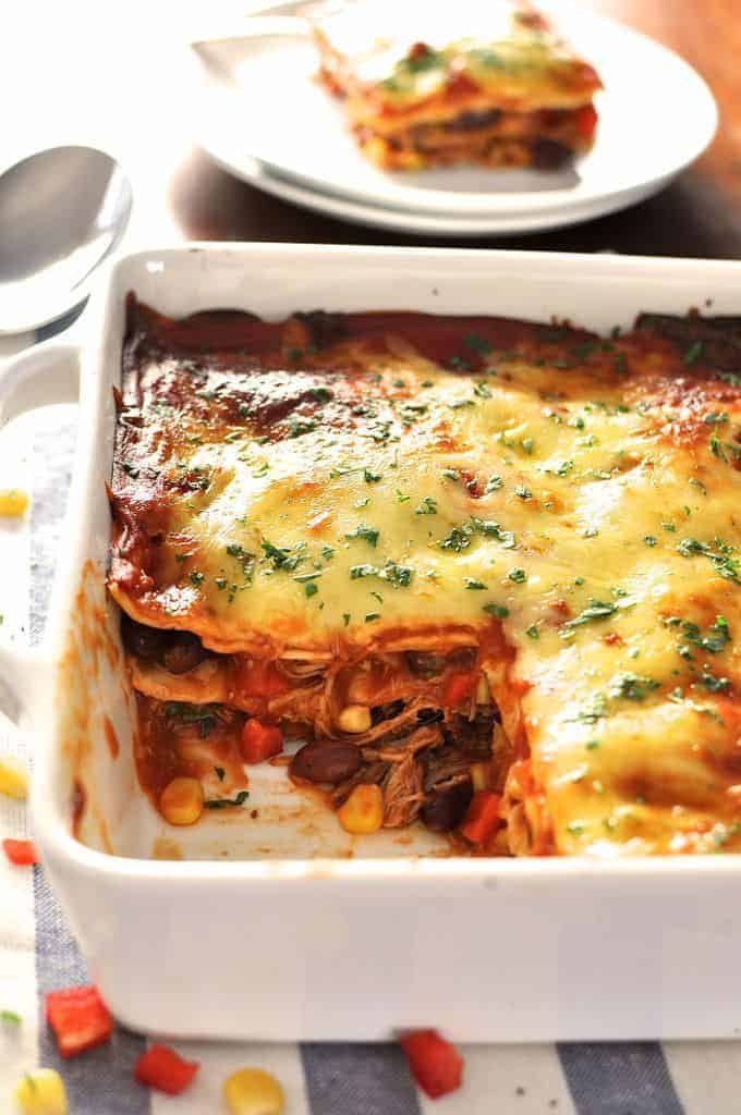 10 minutes to assemble, it's an enchilada - layered up like lasagna! Great for freezing, either before or after baking. #enchilada #mexican #lasagna