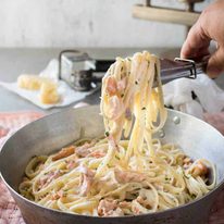 Salmon Alfredo Pasta - Fettuccine tossed in a creamy parmesan sauce and salmon, a magic combination!