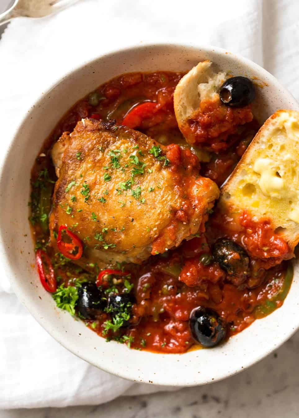 A hearty Italian Chicken Casserole with crispy chicken, capsicum / bell peppers, olives and capers. Sicilian style! www.recipetineats.com