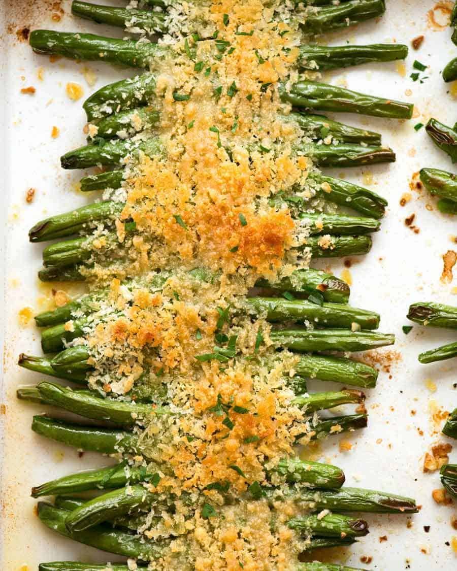 Overhead photo of Parmesan Roasted Green Beans on a tray, fresh out of the oven