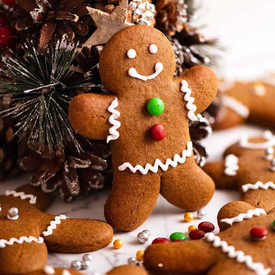 Gingerbread Men propped up on a mini Christmas tree