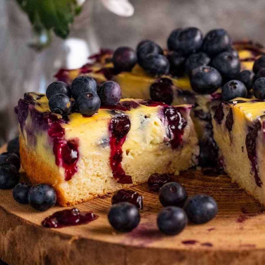 Close up of a slice of Blueberry Custard Cake